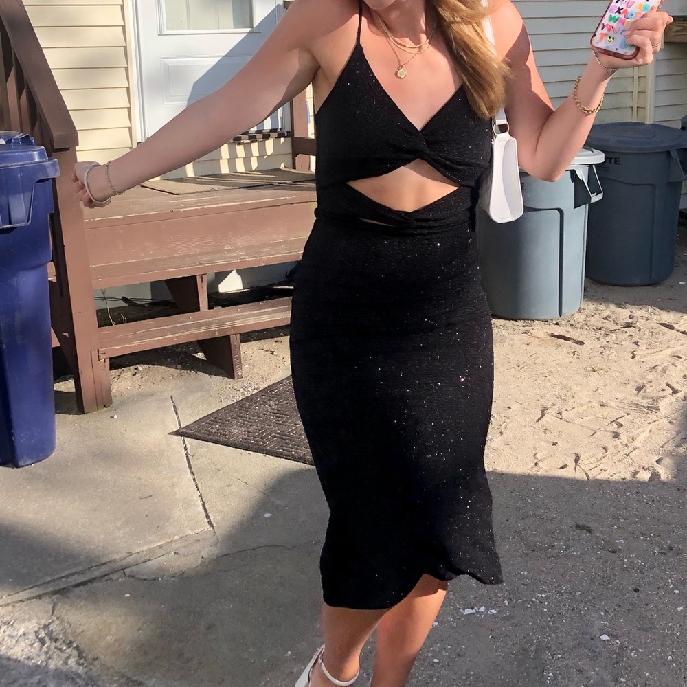 Sparkly black midi dress with front twist